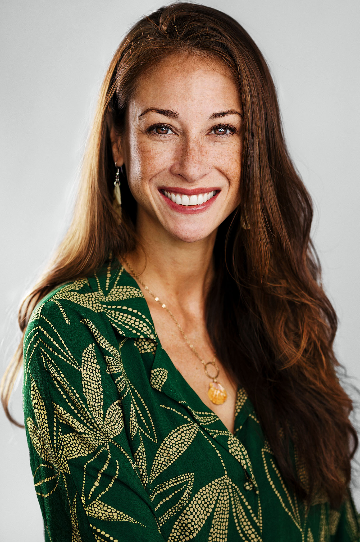 Professional headshot in studio with clean backdrop